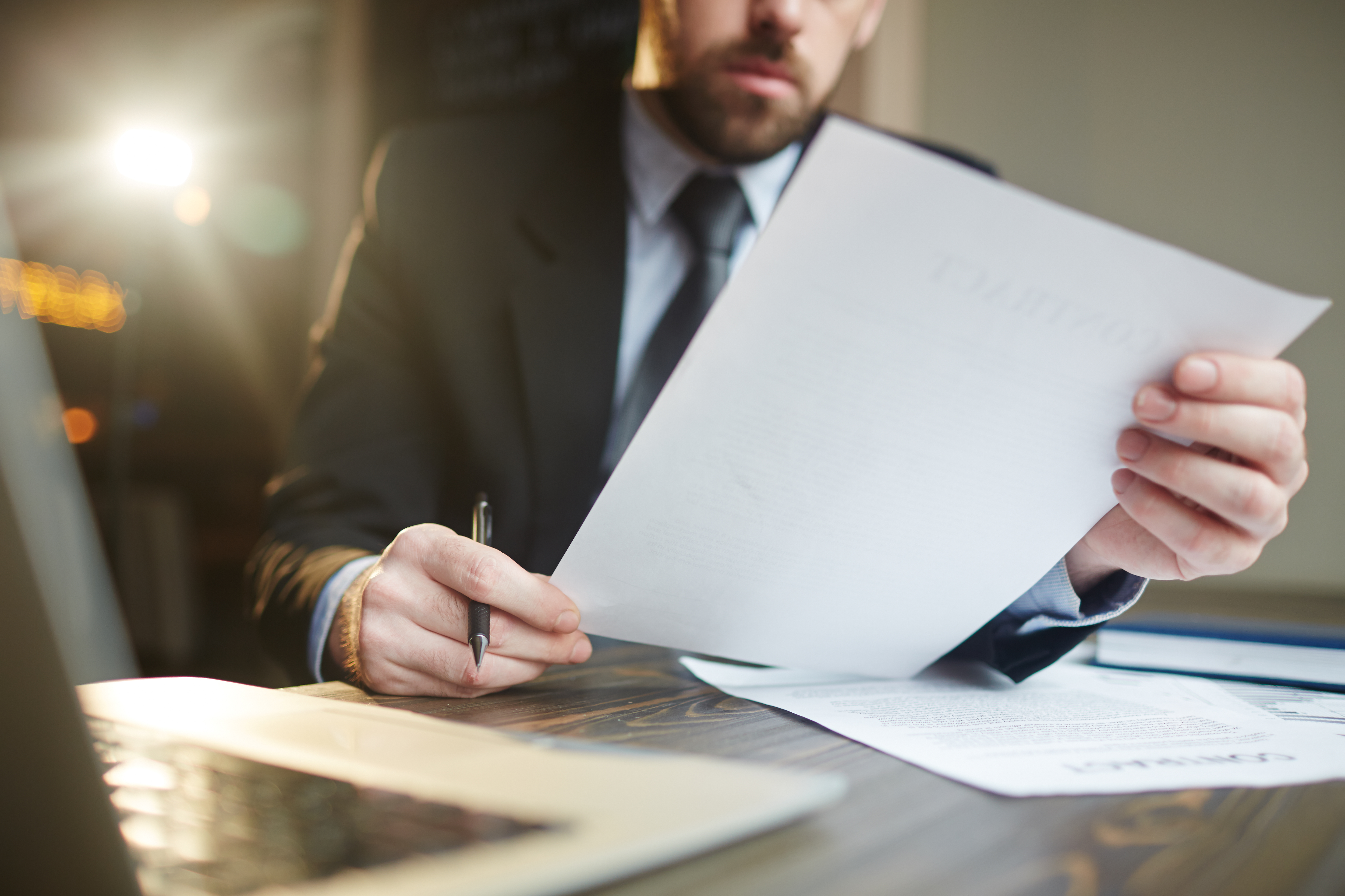 businessman working with documentation-at-desk