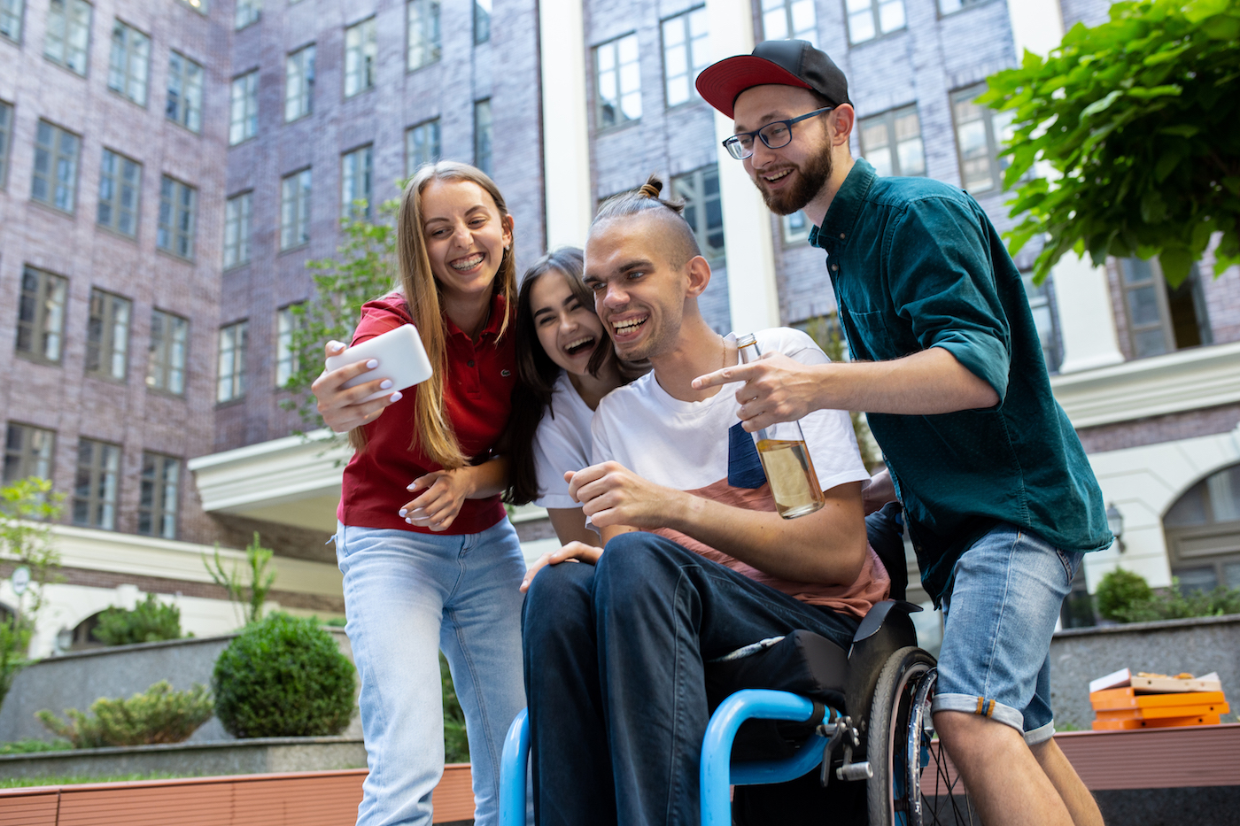 group-of-friends-taking-a-stroll-on-city-s-street-in-summer-day